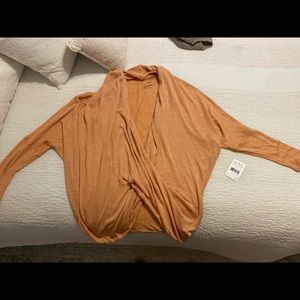 Brand new orange Free People lightweight sweater.